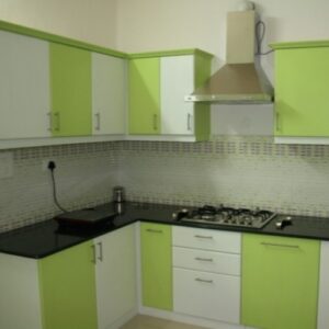 Fresh Green L-Shaped Modular Kitchen with Matte Finish